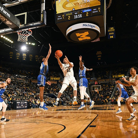 DeVante' Jones (12) and Caleb Houstan (22)