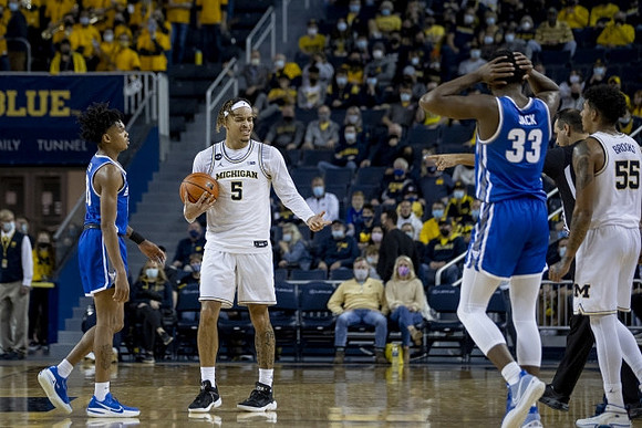 Terrance Williams II (5) and Eli Brooks (55)