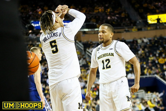 Terrance Williams II (5) and DeVante' Jones (12)