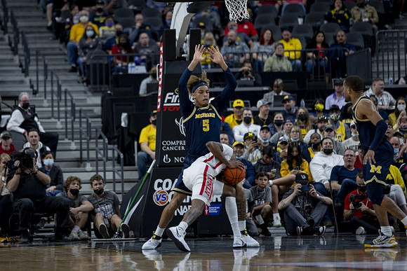 Terrance Williams II (5) and DeVante' Jones (12)