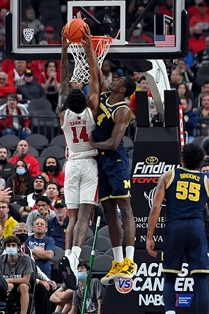Moussa Diabate (14) and Eli Brooks (55)