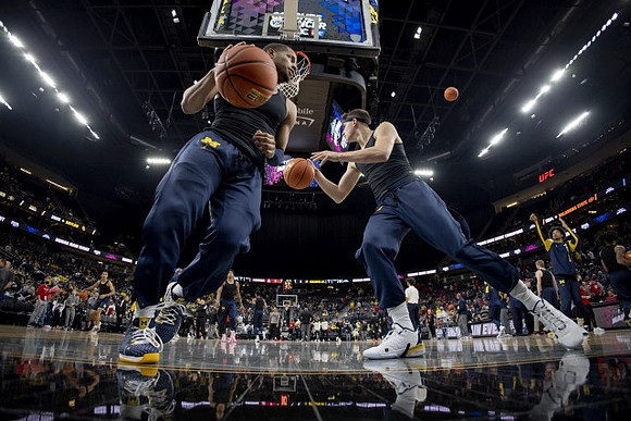 DeVante' Jones (12) and Will Tschetter (42)