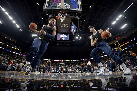 DeVante' Jones (12) and Will Tschetter (42)