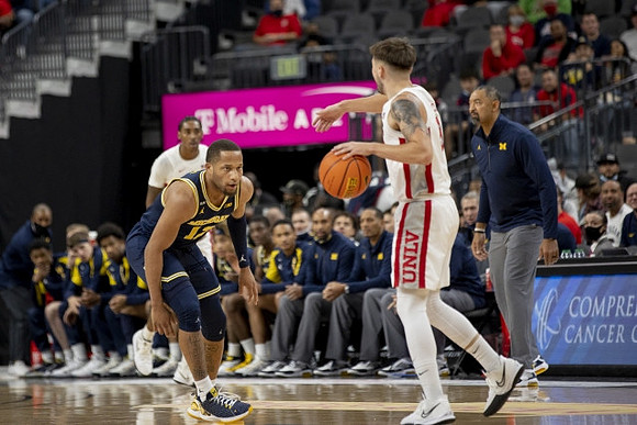 DeVante' Jones (12) and Juwan Howard
