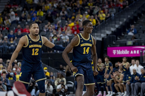 DeVante' Jones (12) and Moussa Diabate (14)