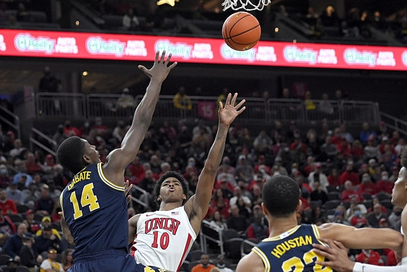 Moussa Diabate (14) and Caleb Houstan (22)