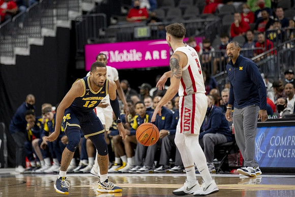 DeVante' Jones (12) and Juwan Howard