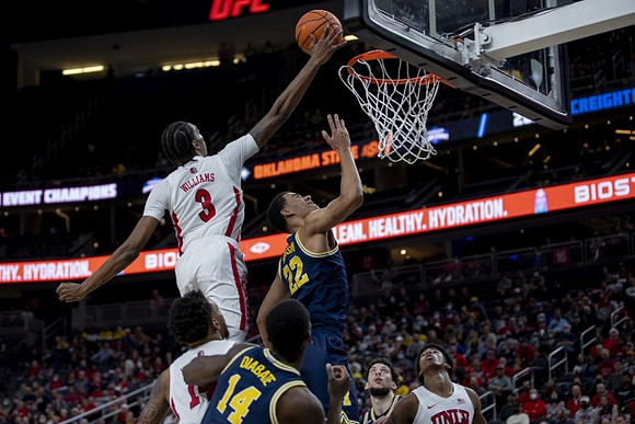 Moussa Diabate (14), Caleb Houstan (22), and Brandon Johns Jr. (23)