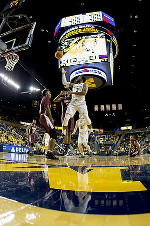 Zavier Simpson (3) and Jon Teske (15)