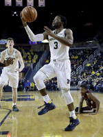 Jon Teske (15) and Zavier Simpson (3)