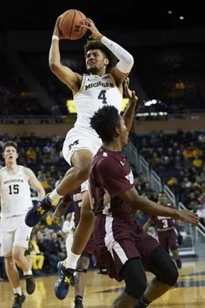 Isaiah Livers (4) and Jon Teske (15)