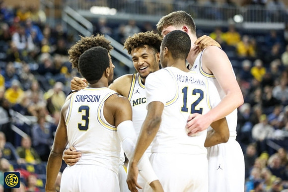 Jordan Poole (2), Zavier Simpson (3), Muhammad-Ali Abdur-Rahkman (12), Isaiah Livers (4), and Jon Teske (15)