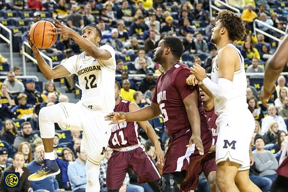Muhammad-Ali Abdur-Rahkman (12) and Isaiah Livers (4)