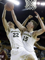 Duncan Robinson (22) and Jon Teske (15)