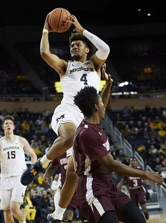 Isaiah Livers (4) and Jon Teske (15)