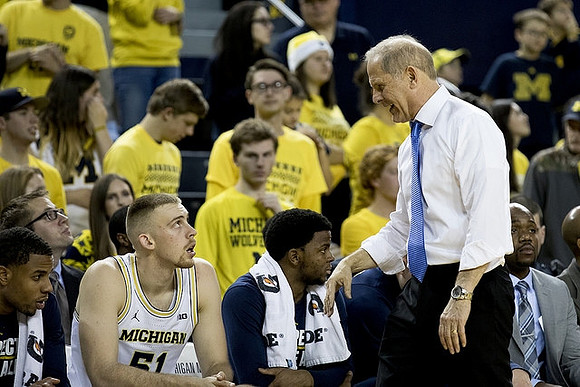 Austin Davis (51) and John Beilein