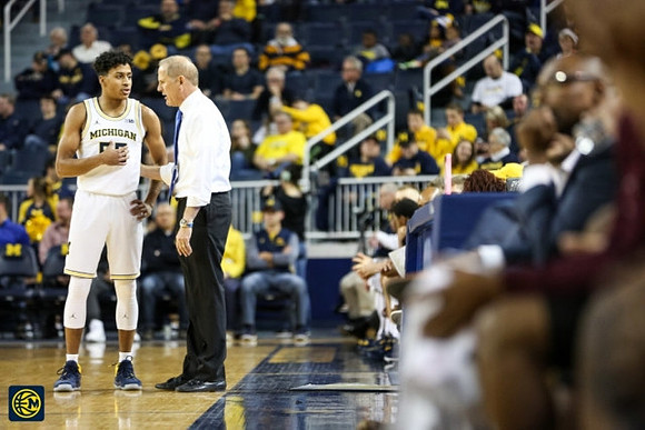 Eli Brooks (55) and John Beilein