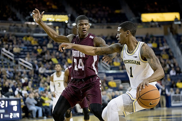 Charles Matthews (1) and Zavier Simpson (3)