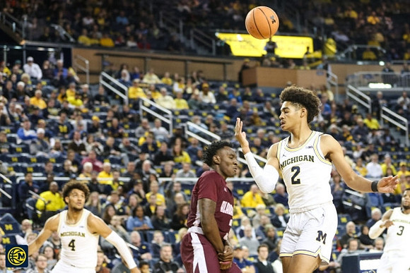 Isaiah Livers (4), Jordan Poole (2), and Zavier Simpson (3)
