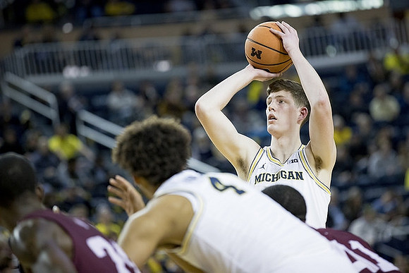 Isaiah Livers (4) and Jon Teske (15)