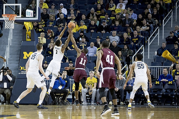Jon Teske (15), Charles Matthews (1), and Eli Brooks (55)