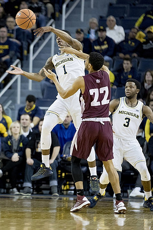 Charles Matthews (1) and Zavier Simpson (3)