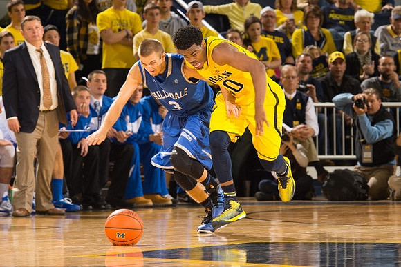Derrick Walton Jr. (10) and Hillsdale Head Coach John Tharp