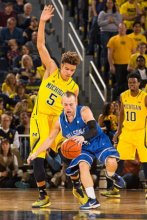 D.J. Wilson (5) and Derrick Walton Jr. (10)