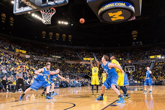 Derrick Walton Jr. (10) and Zak Irvin (21)