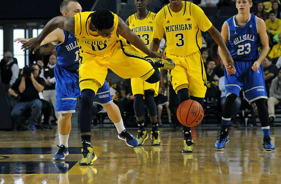 Derrick Walton Jr. (10), Caris LeVert (23), and Kameron Chatman (3)