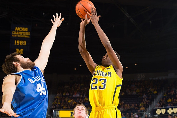 Mark Donnal (34) and Caris LeVert (23)
