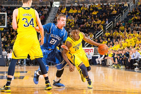 Mark Donnal (34) and Caris LeVert (23)