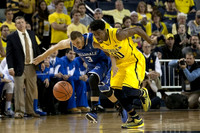 Hillsdale Head Coach John Tharp  and Derrick Walton Jr. (10)