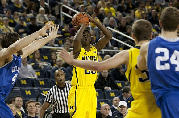 Caris LeVert (23) and Ricky Doyle (32)