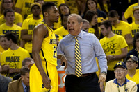 Zak Irvin (21) and John Beilein