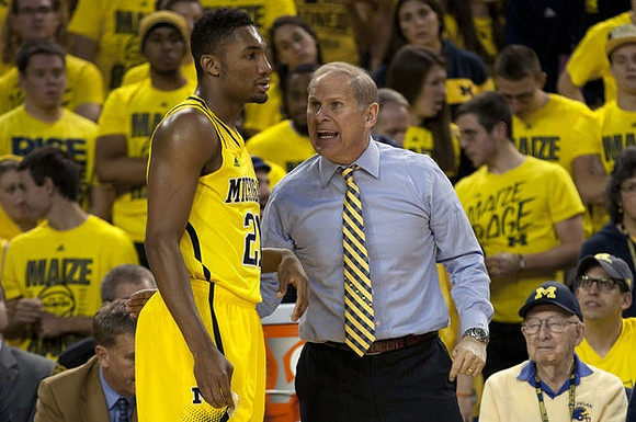 Zak Irvin (21) and John Beilein
