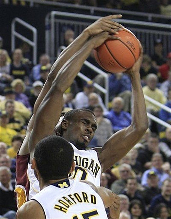 Jon Horford (15) and Tim Hardaway Jr. (10)