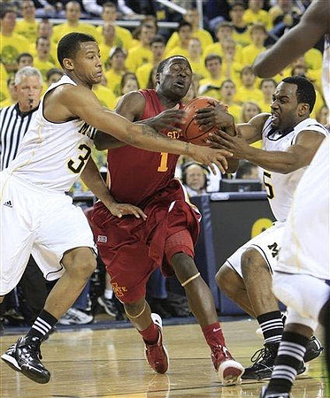 Trey Burke (3) and Eso Akunne (5)