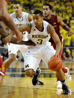 Jordan Morgan (52) and Trey Burke (3)