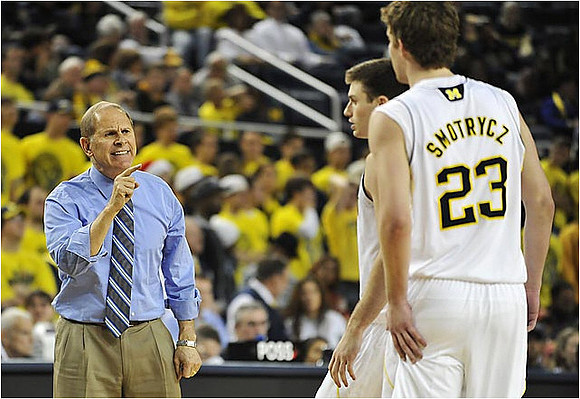 John Beilein, Zack Novak (0), and Evan Smotrycz (23)