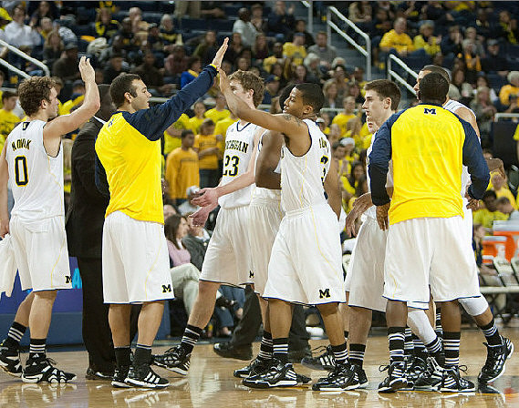 Zack Novak (0), Josh Bartelstein (20), Evan Smotrycz (23), Trey Burke (3), Stu Douglass (1), Jordan Morgan (52), and Corey Person (32)