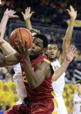 Evan Smotrycz (23) and Jon Horford (15)