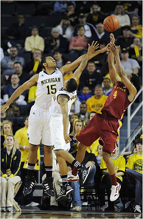 Jon Horford (15) and Trey Burke (3)
