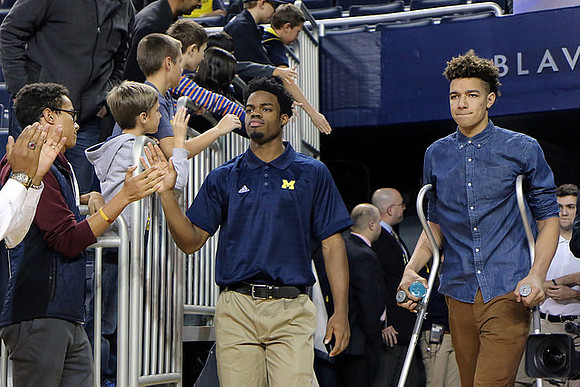 Derrick Walton Jr. (10) and D.J. Wilson (5)