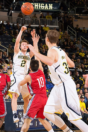 Spike Albrecht (2) and Mark Donnal (34)