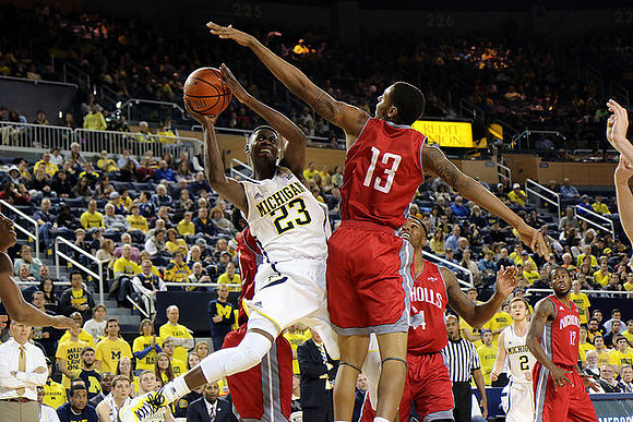 John Beilein, Caris LeVert (23), and Spike Albrecht (2)