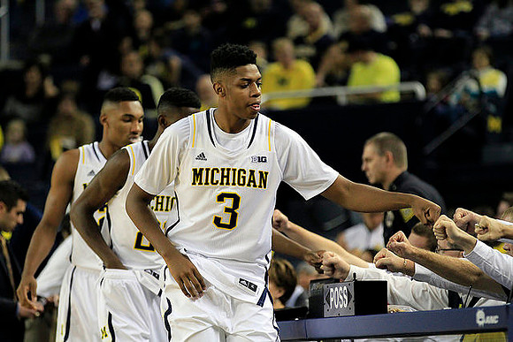 Zak Irvin (21), Caris LeVert (23), and Kameron Chatman (3)