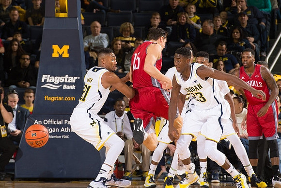 Zak Irvin (21) and Caris LeVert (23)