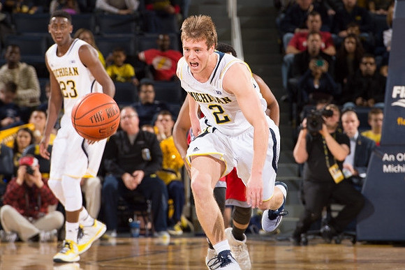 Caris LeVert (23) and Spike Albrecht (2)
