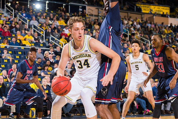 Mark Donnal (34) and D.J. Wilson (5)
